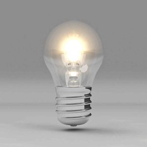 A glowing light bulb emits bright light, suspended against a smooth gray background, highlighting its transparent glass and metallic base.