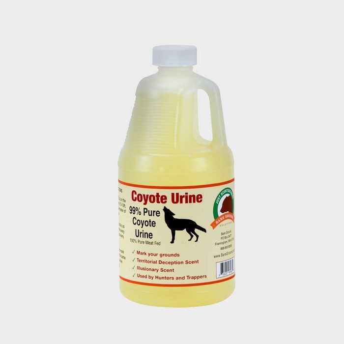 A clear plastic jug contains yellow liquid labeled 