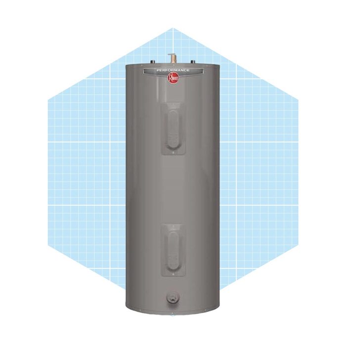 A cylindrical gray water heater stands upright, designed for heating water, set against a light blue geometric background with a grid pattern.