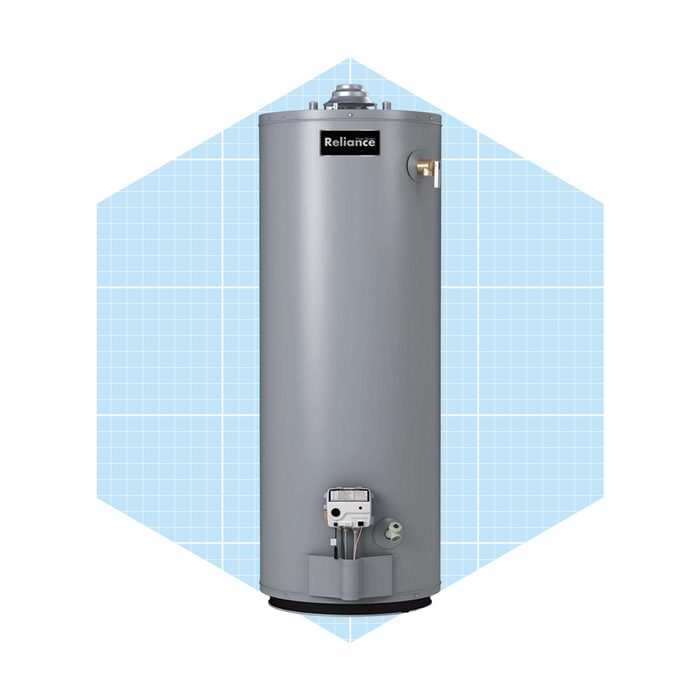 A cylindrical gray water heater stands upright, designed for heating water, set against a light blue graph-patterned background.