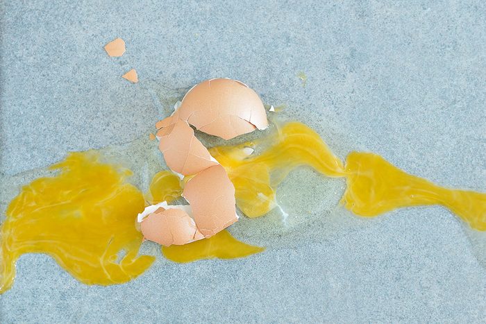 broken egg on the kitchen floor